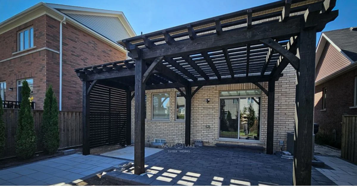 Black timber pergola over patio